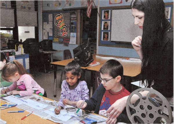 elle Ciardulli- Animation Workshop teaching the children line animation on a 16 mm clear film strip photo credit Chris Karas