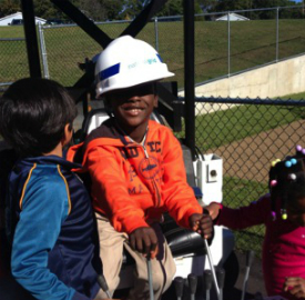Students at Developmental Disabilities Institute (DDI) enjoy Touch-A-Truck Day at the Huntington Campus. National Grid brought natural gas trucks and employees to the school to give the students a chance to get up close with National Grid vehicles. The children enjoyed exploring and pulling the levers on the Dig-It which is used for excavating. DDI received a Cinderella Grant from National Grid for revitalization and improvements to the school. Photo Credit: DDI.